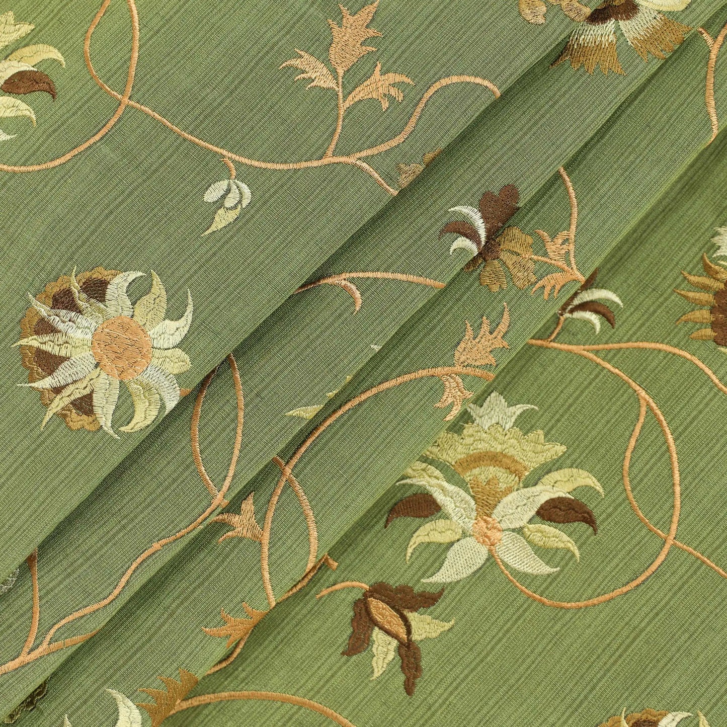 Crest embroidered silk fabric